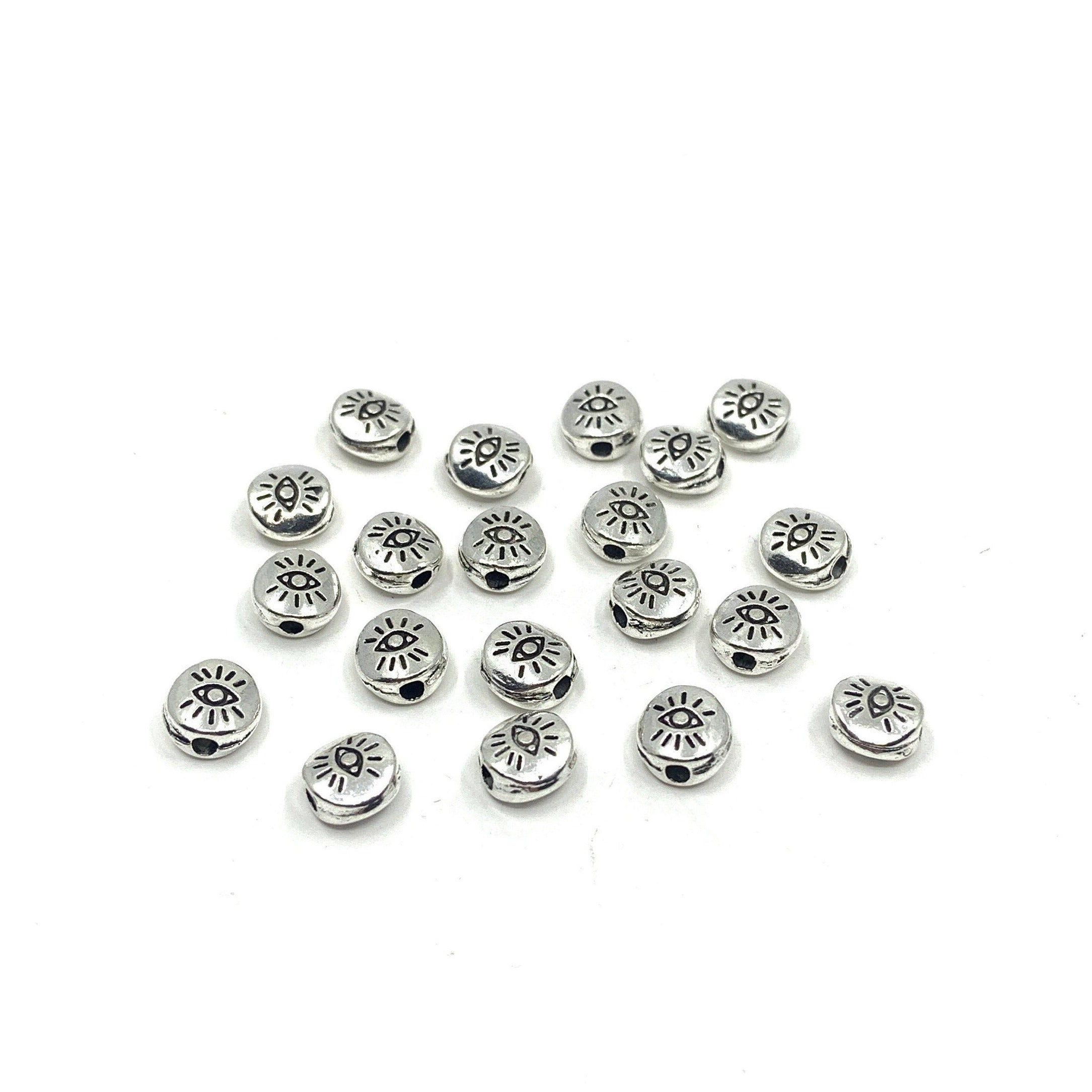 20pcs Flat round Tibetan Style Evil eye beads shown against a white background