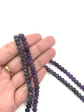 Faceted Amethyst, faceted lolite beads shown on hand for size reference