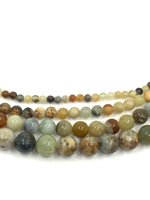 4mm, 6mm, 8mm and 10mm size of flower jade beads shown in comparison